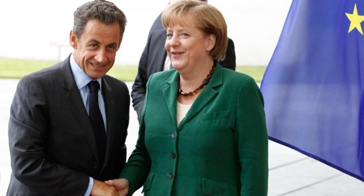 Меркель и Саркози решают, как спасти евро