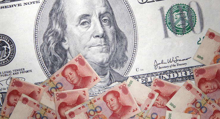 Юань обновляет шестилетний минимум к доллару